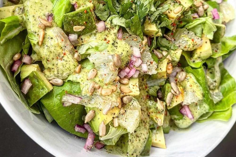 Avocado Salad with Red Onions in bowl